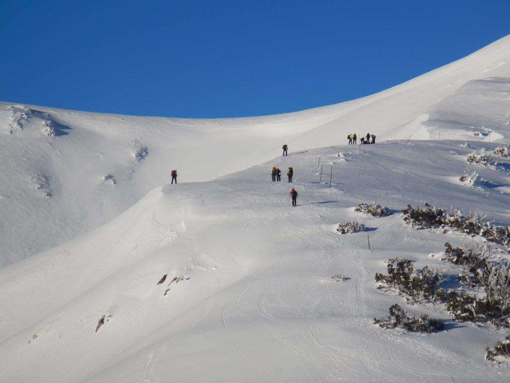 Searchers assembling above the avalanche site